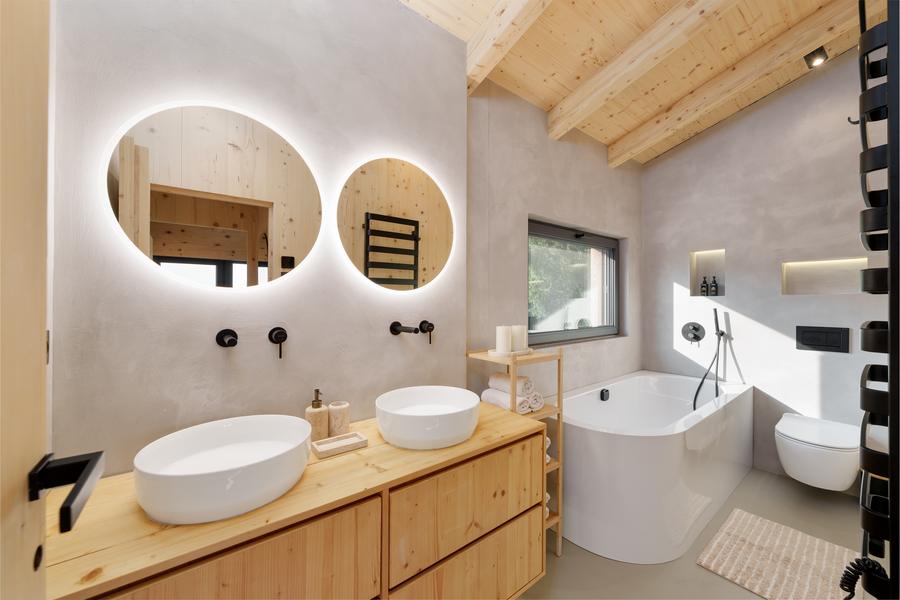 One of the two bathrooms, with twin basins and a freestanding bath